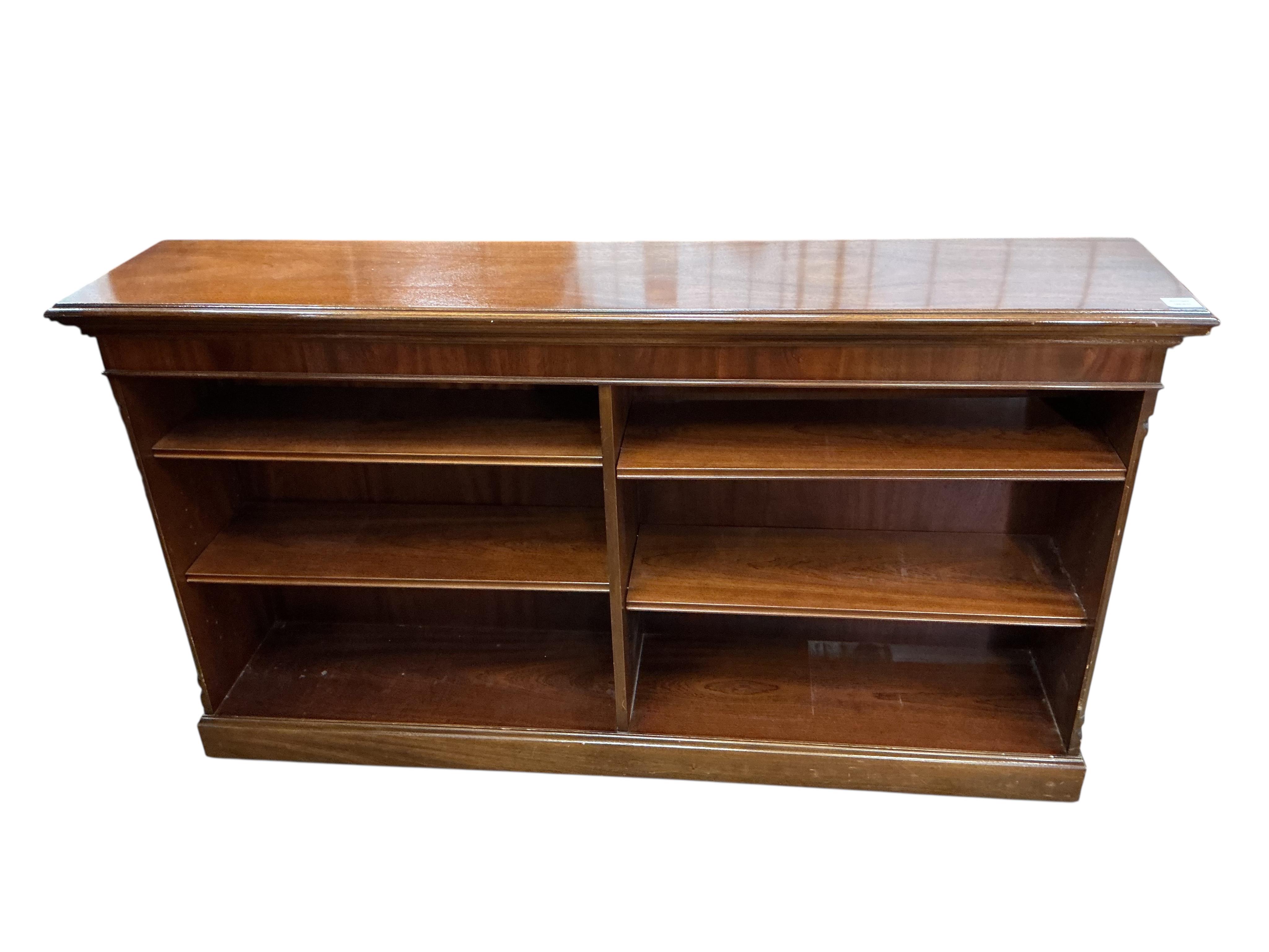 A reproduction mahogany dwarf open bookcase, width 152cm, depth 32cm, height 86cm